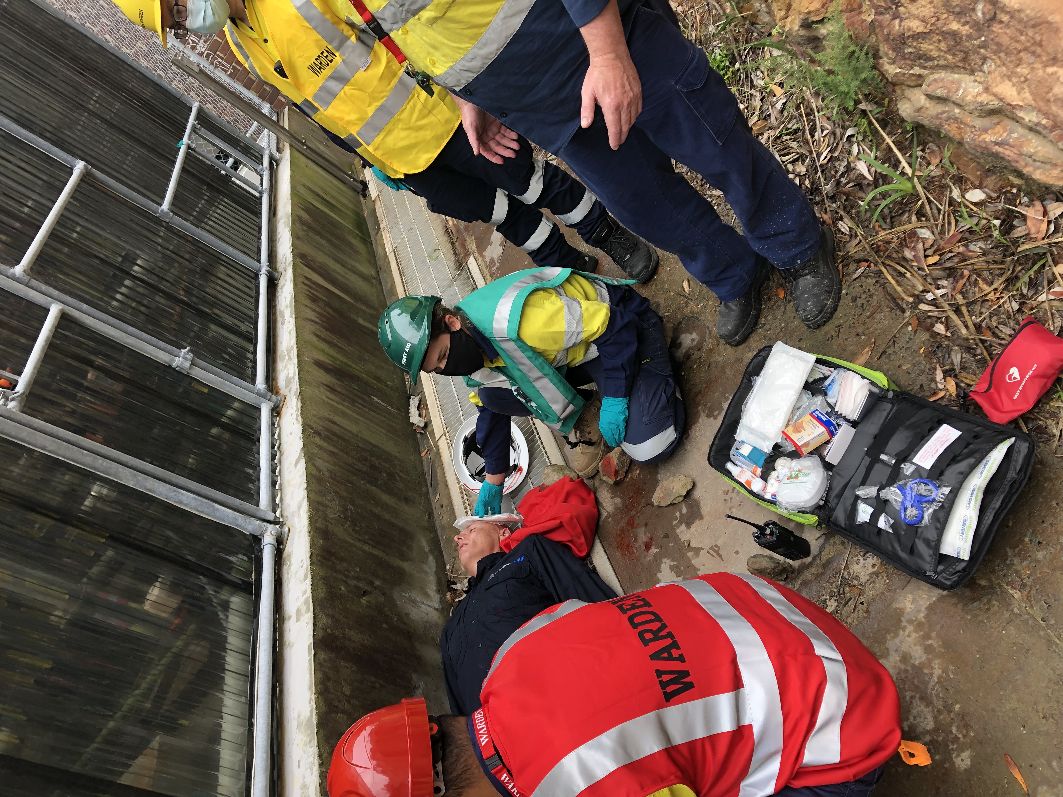 Wardens giving first aid to a casualty during an emergency exercise